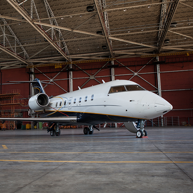 Airplane Parked In Hangar