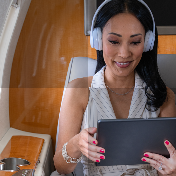 Woman in cabin using ThnkPad