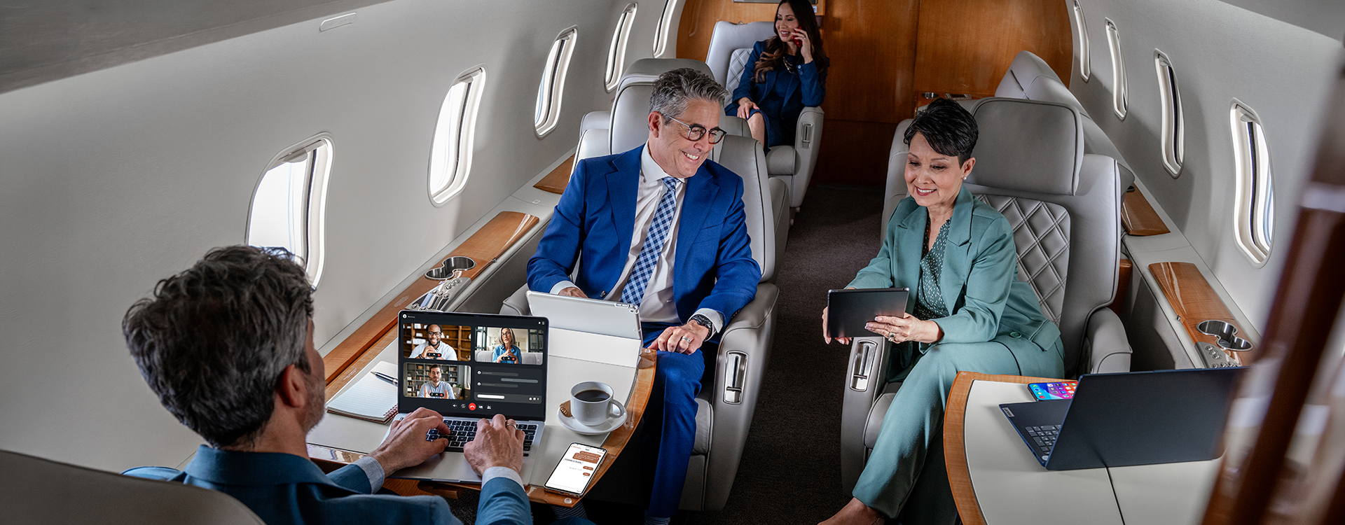People on devices sitting in cabin People on devices sitting in cabin